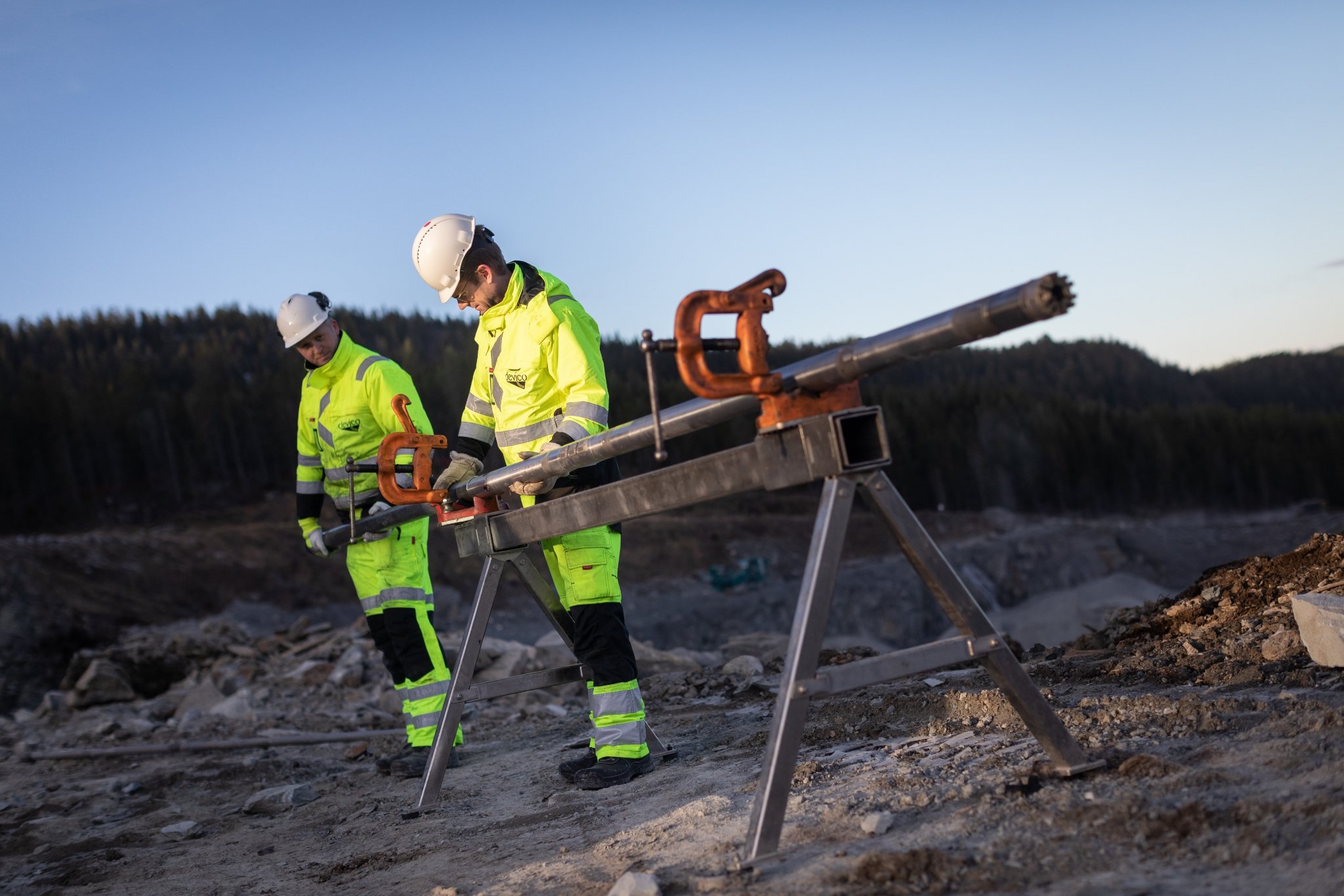 Two operators with a DeviDrill in the field