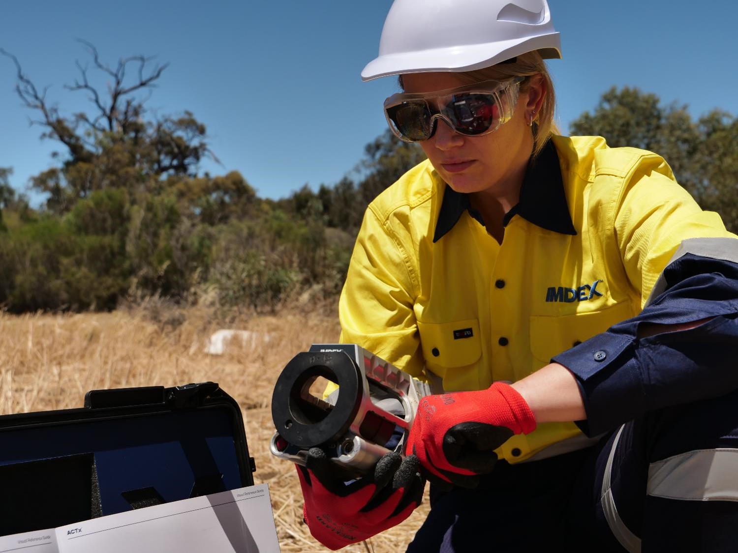 Female employee on site, using ACTx Structural Geology solution