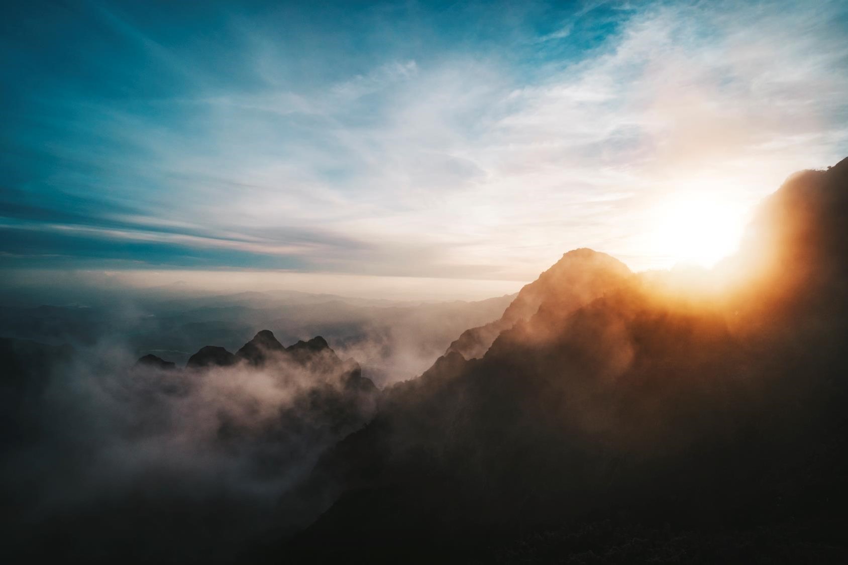 sunrise on cloudy mountains landscape