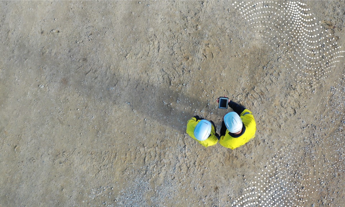 aerial shot of employees with tablet