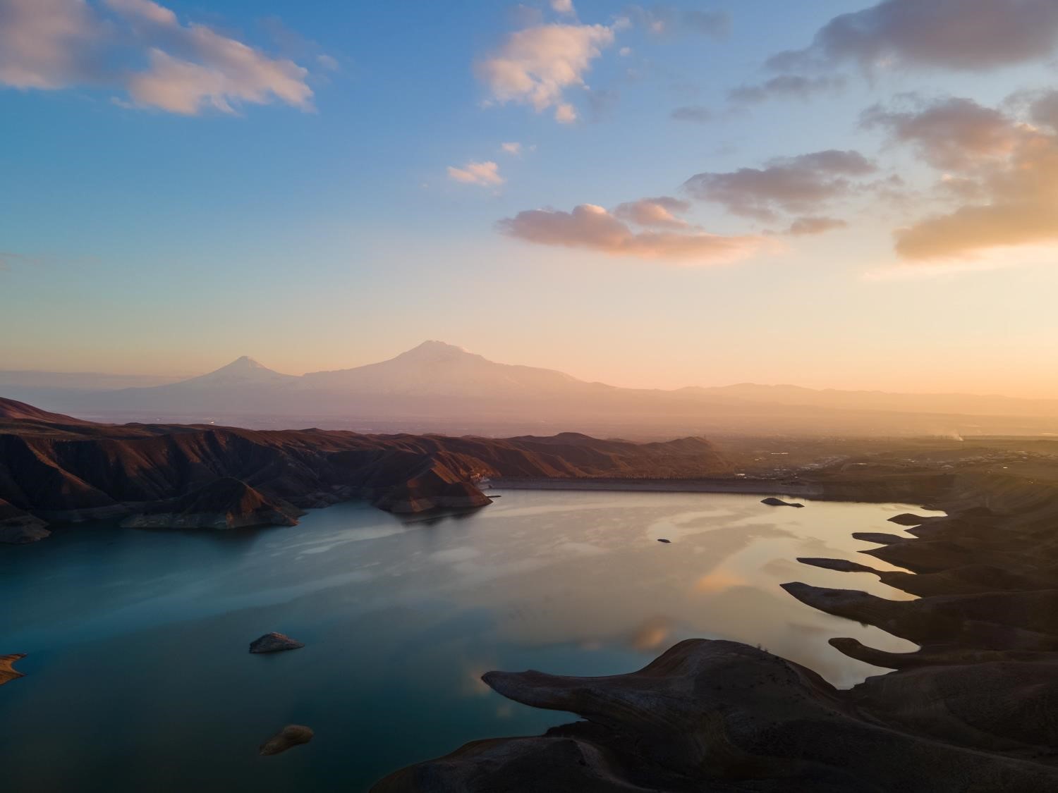 sunset view with a lake and mountain landscape
