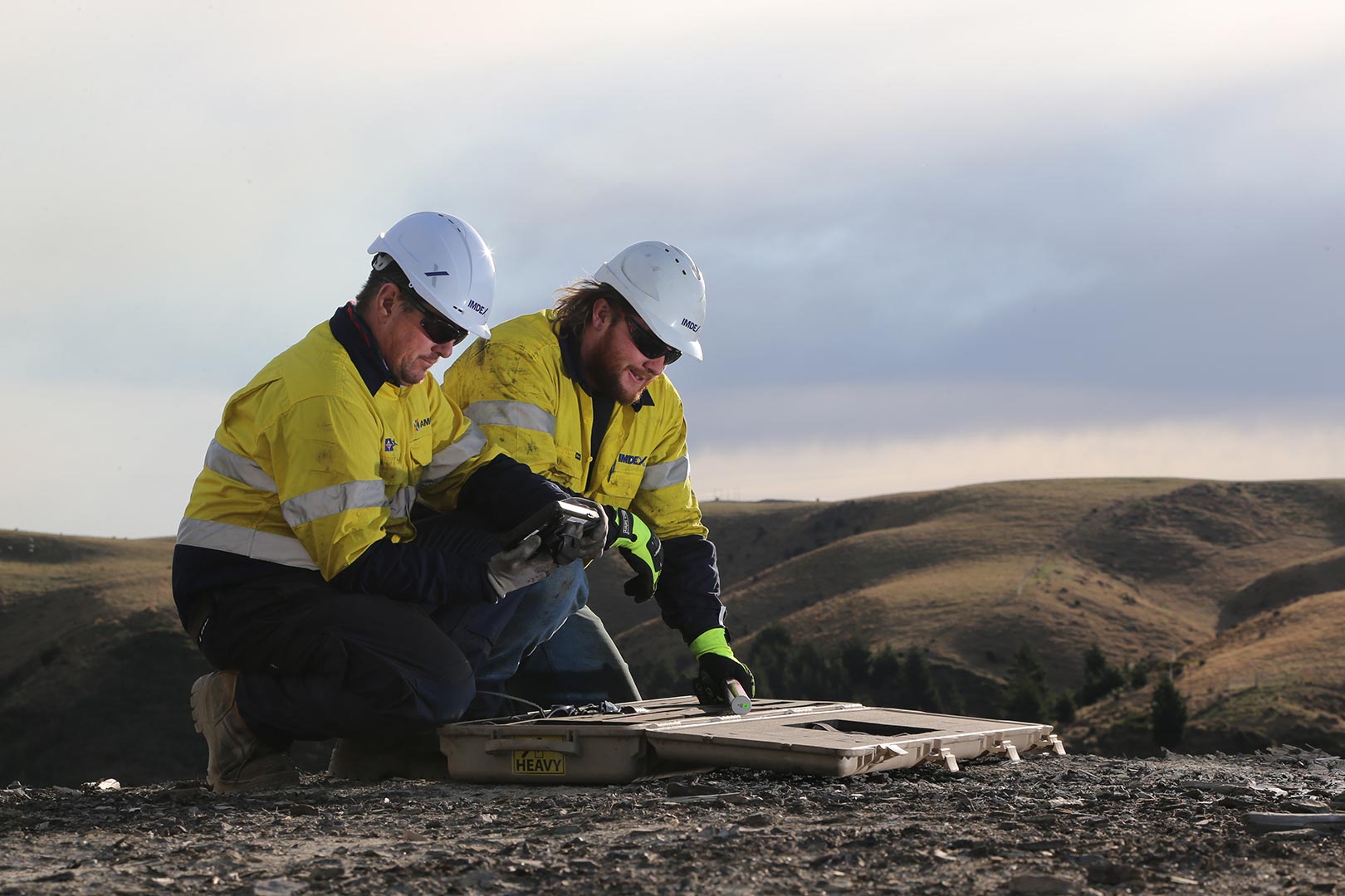 IMDEX operators at mine site checking survey tools