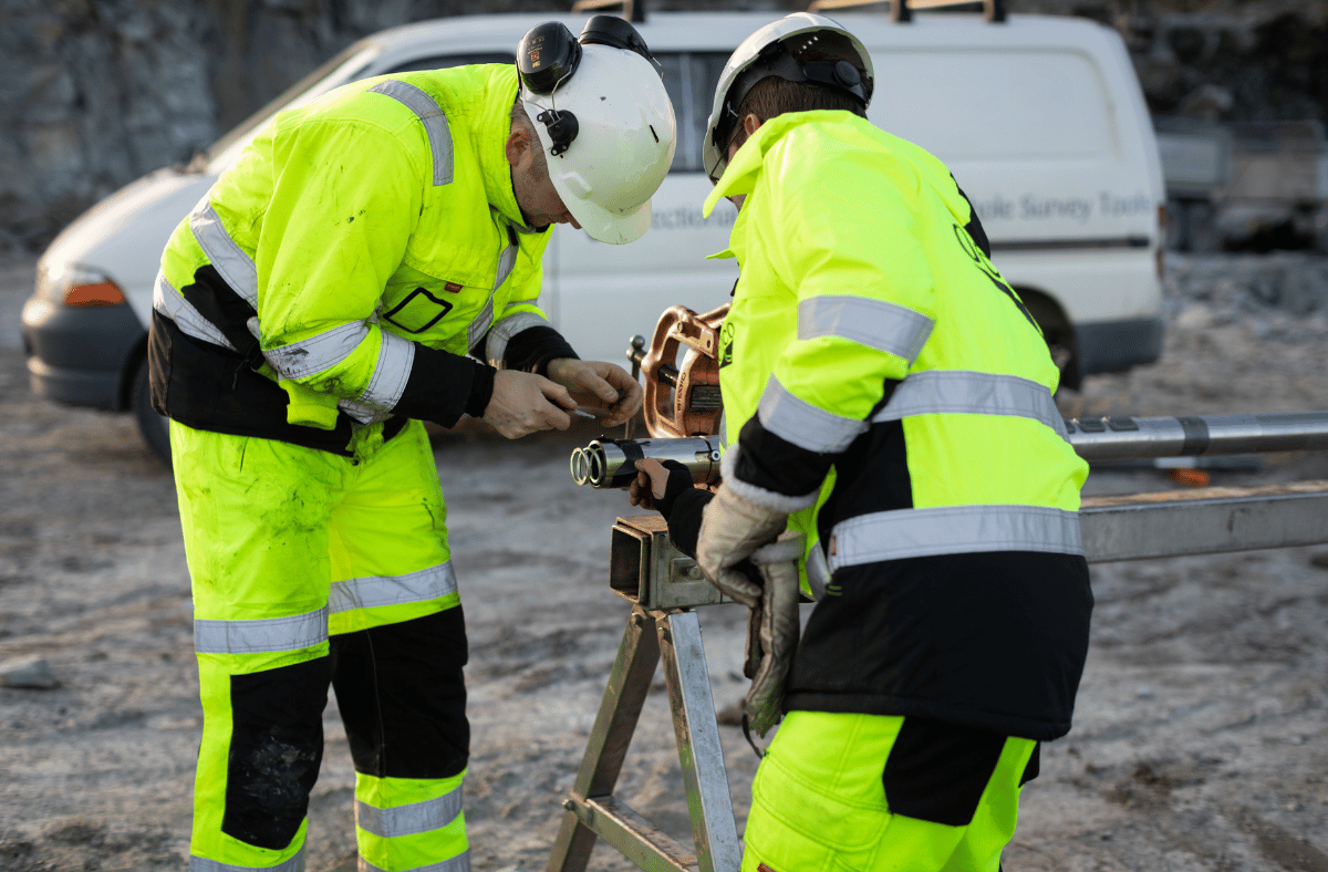 two employees checking a directional drilling tool